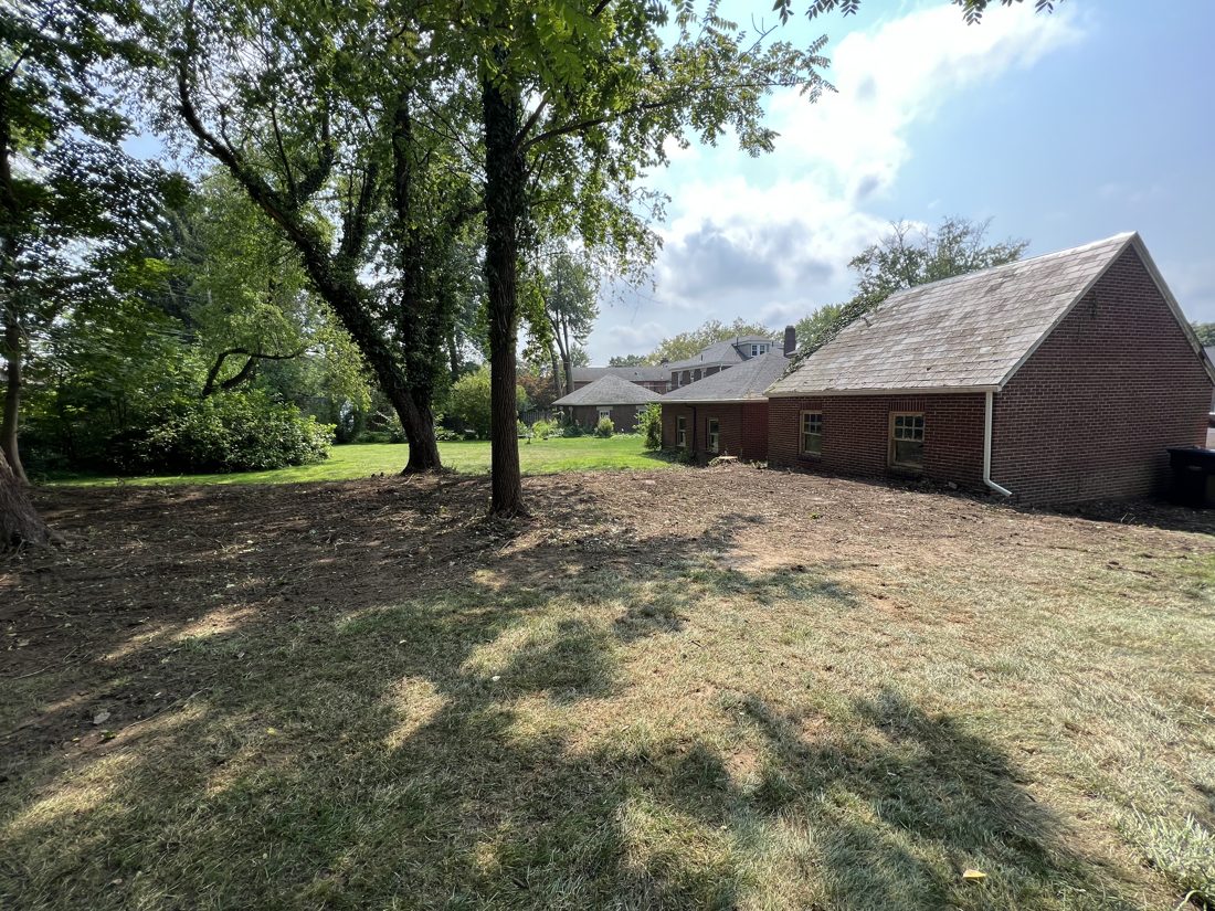 Cleared and graded lot beside a home