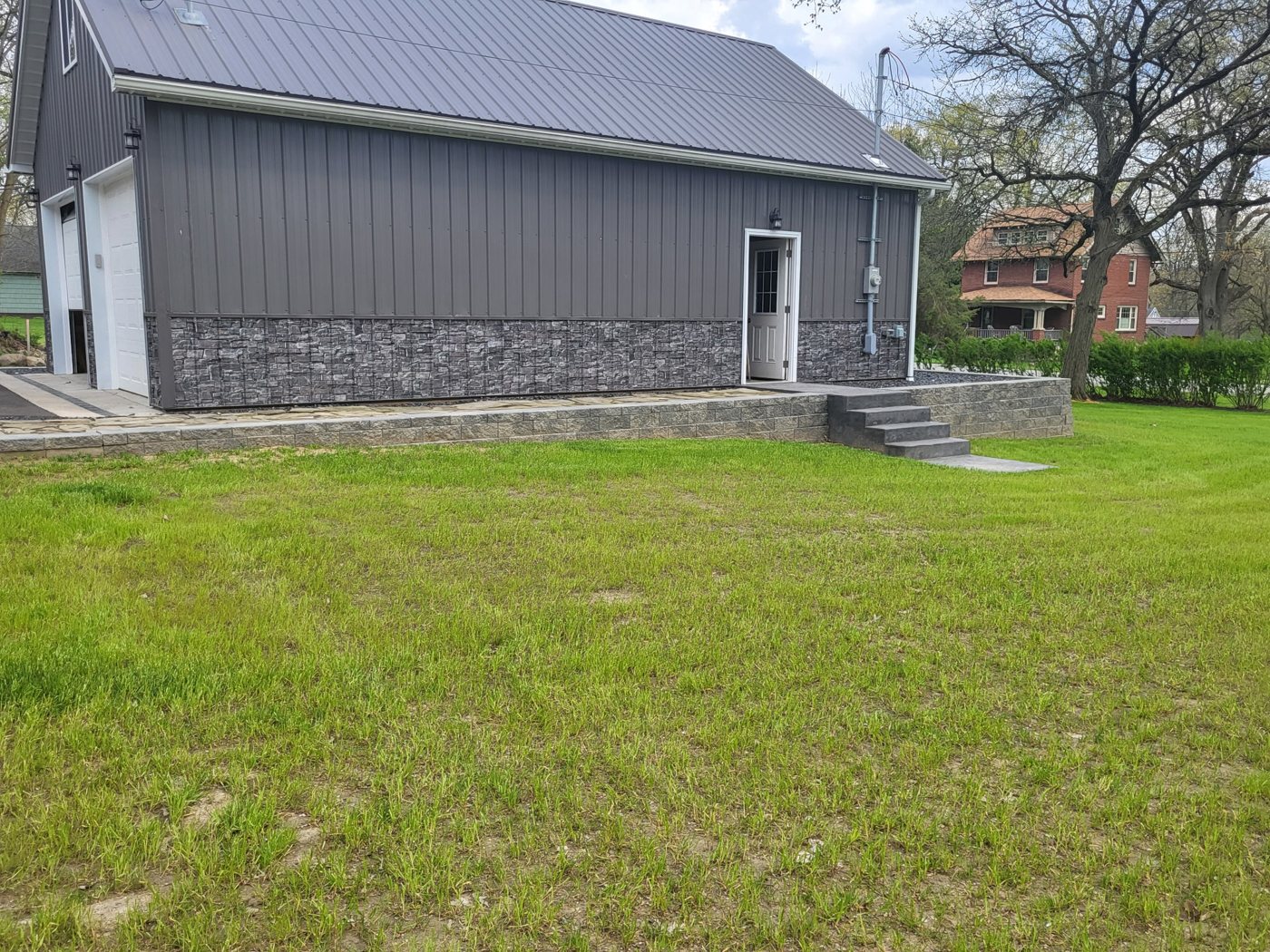 Finished stone-veneer retaining wall